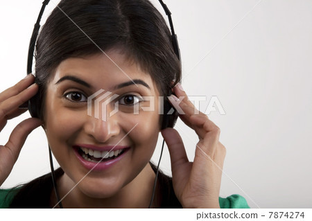 Woman listening to music Woman listening to music 7874274