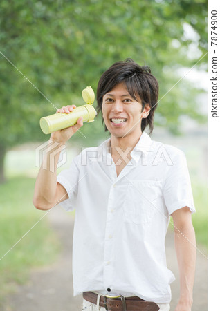 A man with a water bottle 7874900