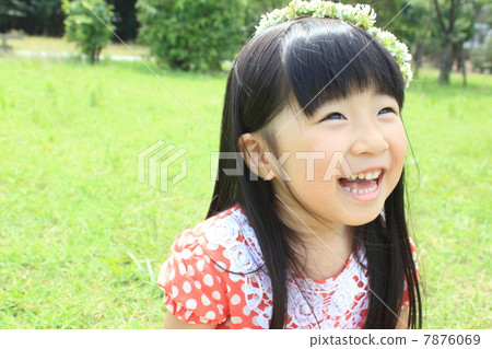 A girl wearing a cloth of white clover A girl wearing a cloth of white clover 7876069