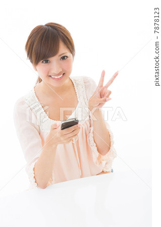 A woman watching a smartphone A woman watching a smartphone 7878123
