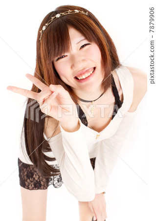 A cute girl who makes a piece with a camera look with a funny smile 7879906