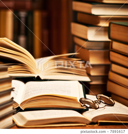 opened book, lying on the bookshelf opened book, lying on the bookshelf 7891617