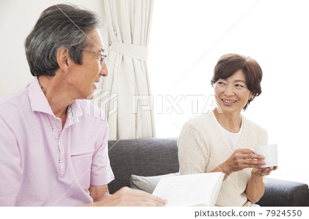 A couple who talks in the living room A couple who talks in the living room 7924550