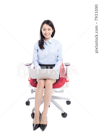 Woman using a laptop Woman using a laptop 7931090