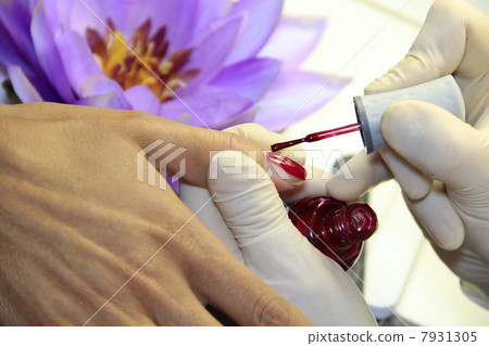 Female Hand - in manicure treatment - before 7931305