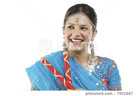 Gujarati woman with dandiya sticks 7932687