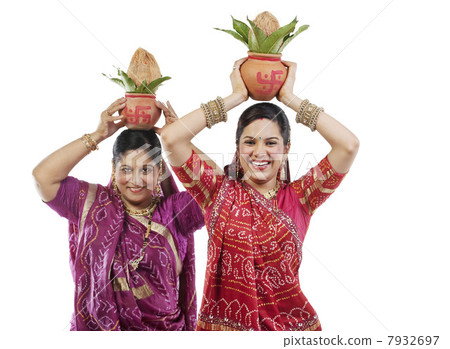 Mother and daughter holding Kalash 7932697