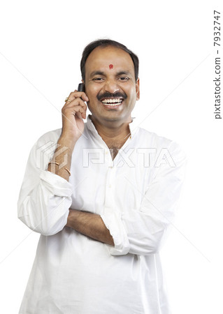 Man talking on a mobile phone Man talking on a mobile phone 7932747