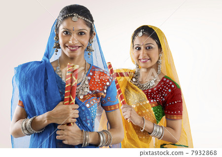 Gujarati women with dandiya sticks 7932868