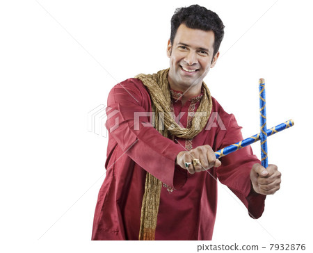 Gujarati man with dandiya sticks Gujarati man with dandiya sticks 7932876