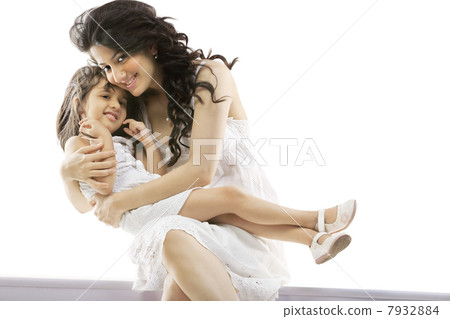 Mother holding her daughter 7932884