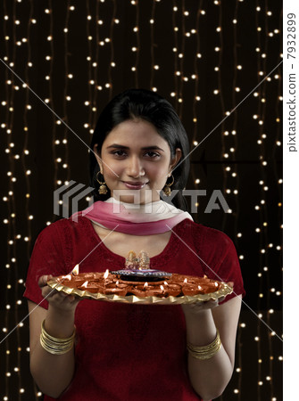 Portrait of a woman with a tray of diyas Portrait of a woman with a tray of diyas 7932899