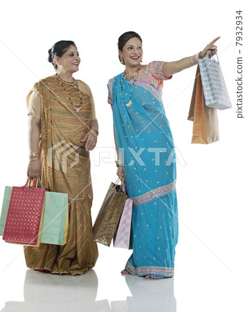 Gujarati mother and daughter with shopping bags 7932934