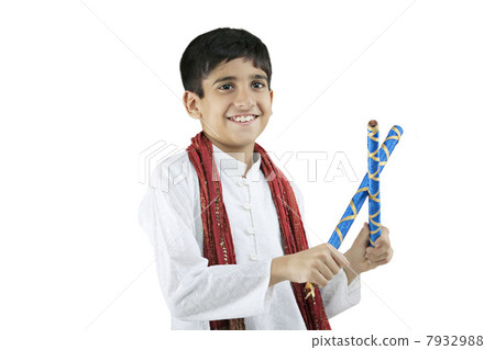 Gujarati boy with dandiya sticks 7932988