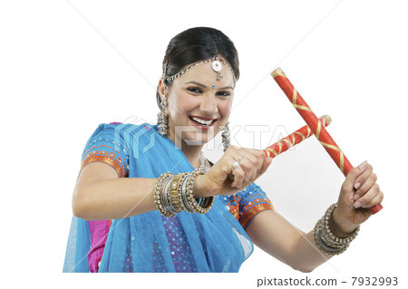 Gujarati woman with dandiya sticks Gujarati woman with dandiya sticks 7932993