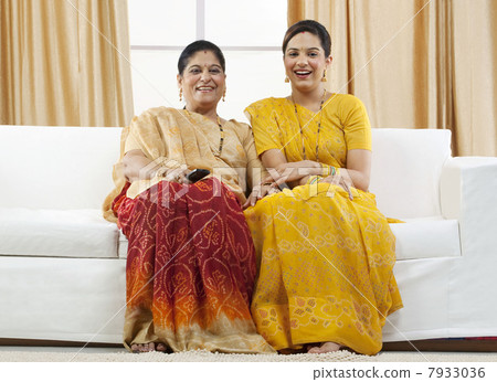 Mother and daughter watching television Mother and daughter watching television 7933036