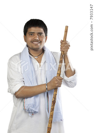 Portrait of a man with a stick 7933147