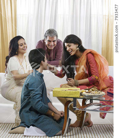 Girl feeding her brother during Rakhi Girl feeding her brother during Rakhi 7933477