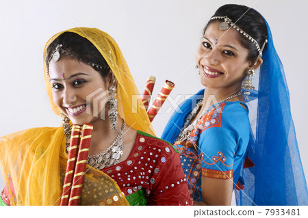 Gujarati women with dandiya sticks Gujarati women with dandiya sticks 7933481