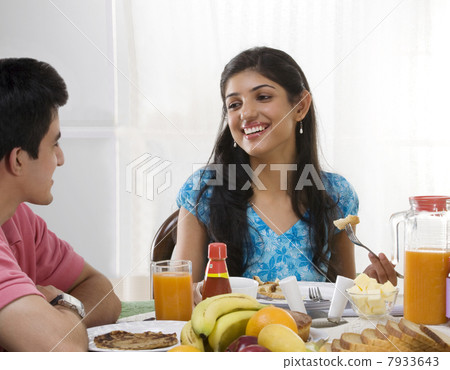 Brother and sister having breakfast Brother and sister having breakfast 7933643
