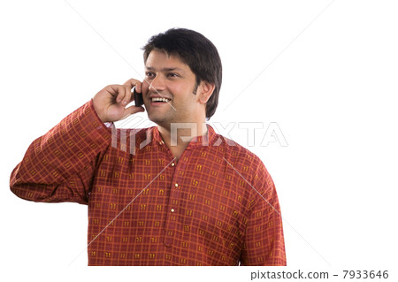 Man talking on a mobile phone 7933646