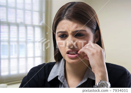 Businesswoman getting worried at work Businesswoman getting worried at work 7934031
