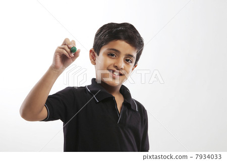 Young boy holding a marker pen Young boy holding a marker pen 7934033