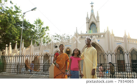 Maharashtrian family standing in front of a church 7934065