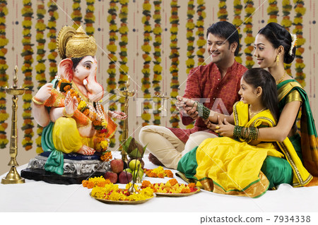 Family performing a pooja Family performing a pooja 7934338