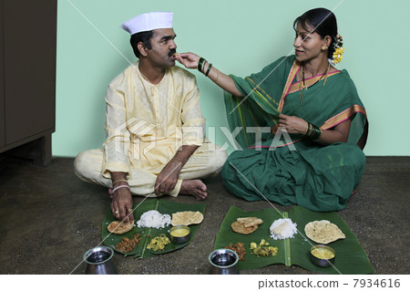 Wife feeding her husband Wife feeding her husband 7934616
