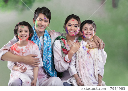 Family posing after playing holi 7934963