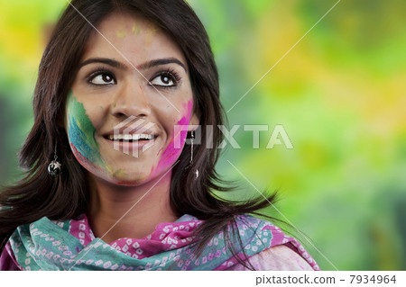 Woman with colour on her face Woman with colour on her face 7934964