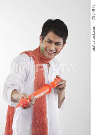 Man with a pichkari 7934972