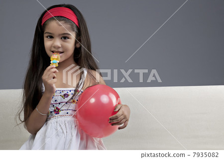Girl having a lollipop Girl having a lollipop 7935082
