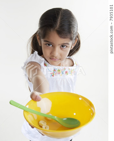 Girl holding a plastic bowl 7935101