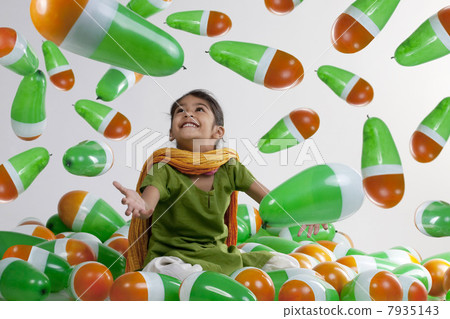 Girl sitting with balloons 7935143