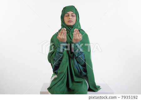 A Muslim woman praying 7935192