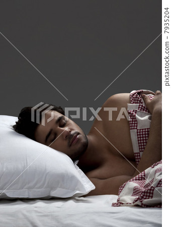 Man sleeping in bed Man sleeping in bed 7935204
