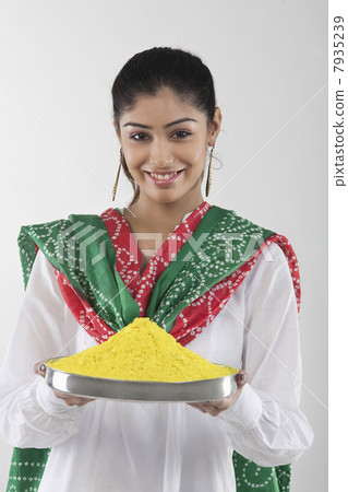 Woman holding a tray of colours Woman holding a tray of colours 7935239