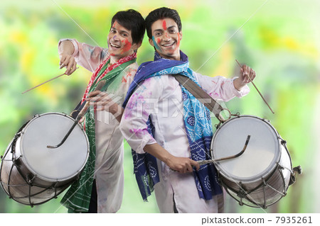 Two men playing on dhols Two men playing on dhols 7935261