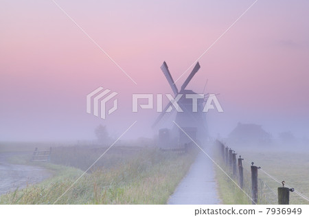 charming Dutch windmill in morning mist charming Dutch windmill in morning mist 7936949