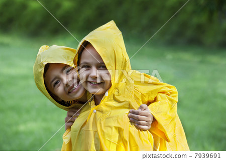 Portrait of smiling girls wearing raincoats Portrait of smiling girls wearing raincoats 7939691