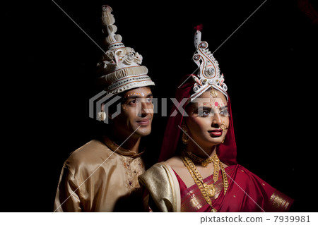 Bengali bride and groom with a topor 7939981