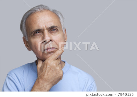 Close-up of senior man over colored background 7940125