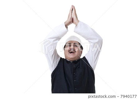 Male politician with hands raised 7940177