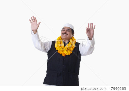 Happy politician with arms raised 7940263
