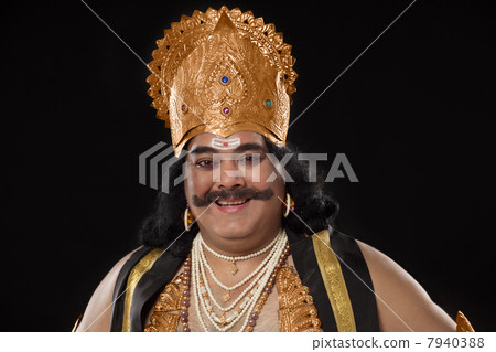 Portrait of a man dressed as Raavan smiling 7940388