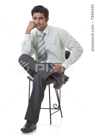 Smart male executive thinking over white background 7940393
