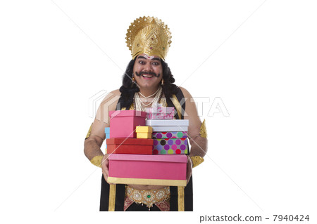 Man dressed as Raavan holding gifts Man dressed as Raavan holding gifts 7940424