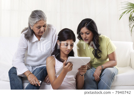 Family reading documents at home 7940742